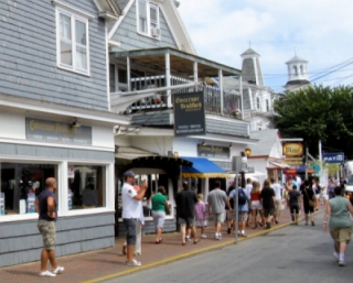 photo of people shopping in Provincetown on Commercial Street with restaraunts, bars and stores