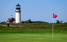 photo of golfing on Cape Cod at Highland Links in North Truro, MA showing Highland Light in the background of one of the holes combining both of these Cape Cod attractions in one photo