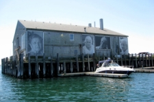 Coastguard pier in Provincetown with artowrk depicting some of the older women of Provincetown