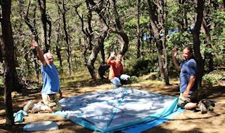 image of camping on Cape Cod showing campers setting up their tent at North of Highland Camping Area