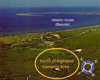 Aerial photo taken over North of Highland Camping Area showing how wooded this Cape Cod camping area is. Also shows Provincetown and the tip of Cape Cod curving in the backround.